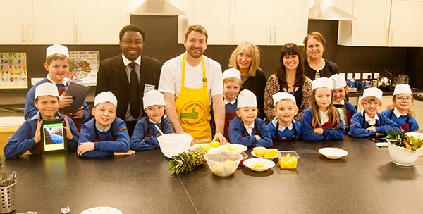 high view school pupils in a cooking class