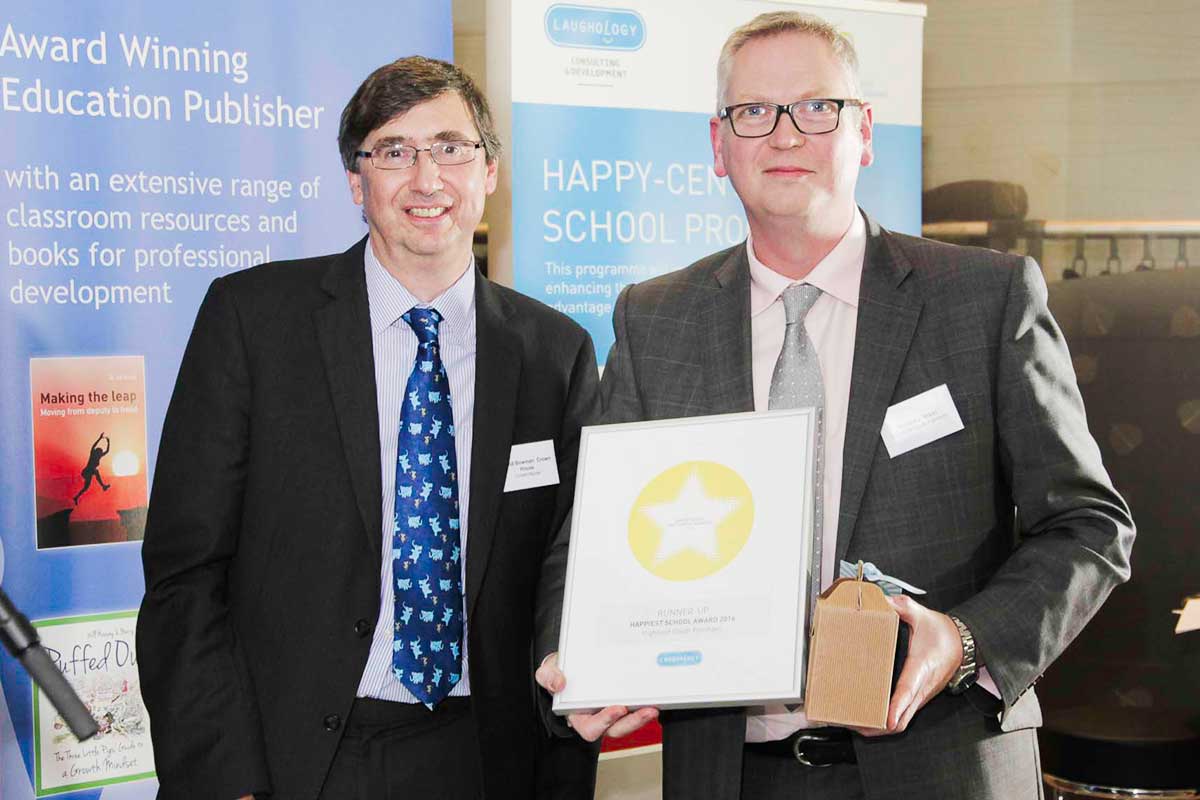 Highfield South Farnham celebrates third place in the Happiest School category Headteacher Gregory West receives the award